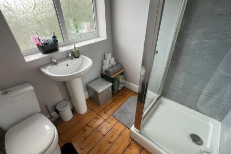 Bright, well-kept bathroom with a walk-in showe...