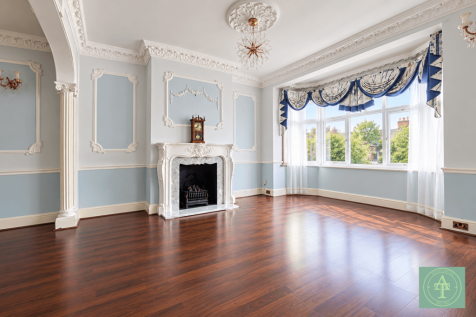 Elegant Victorian Living Room with Bay Windows