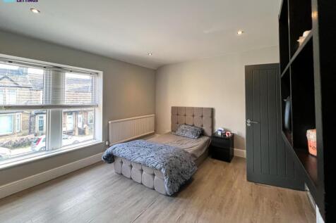 Bright, spacious bedroom with stylish flooring...