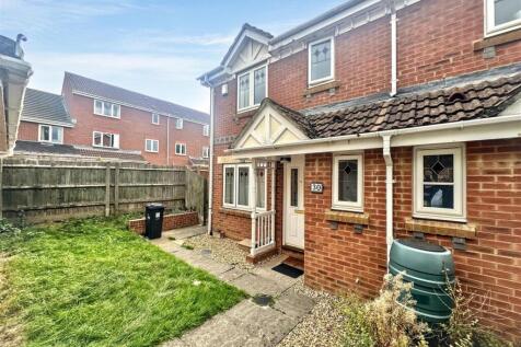 Charming front exterior with private lawn garde...