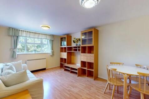 Bright, well-presented living room with a large...