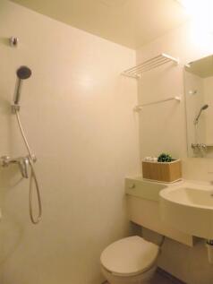 Compact, well-kept bathroom with a wall-mounted...