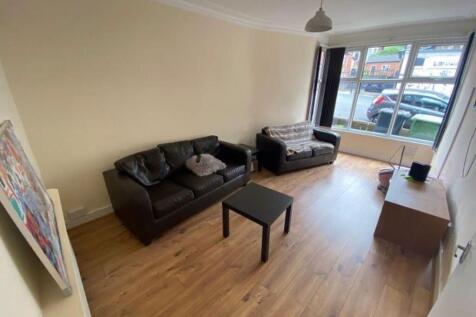 Spacious and well-lit contemporary living room ...