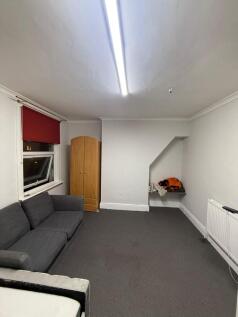 Cosy lounge with comfortable seating and storag...