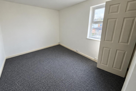Clean Empty Room with Open Door.png