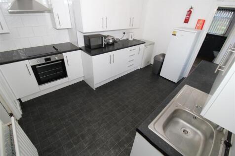 Bright and modern kitchen with ample storage...