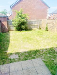 Sunny private rear garden with lawn, paved pati...