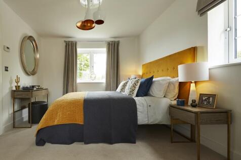 The main bedroom has ample space for wardrobes and a dressing table or desk
