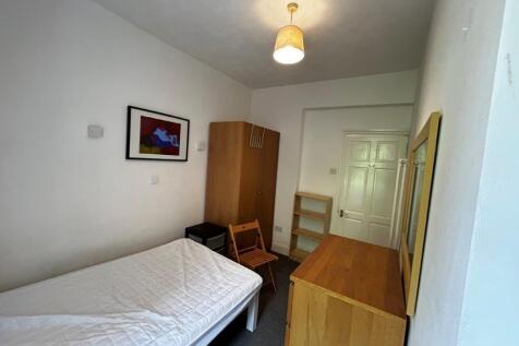 Bright bedroom with ample storage and desk area...