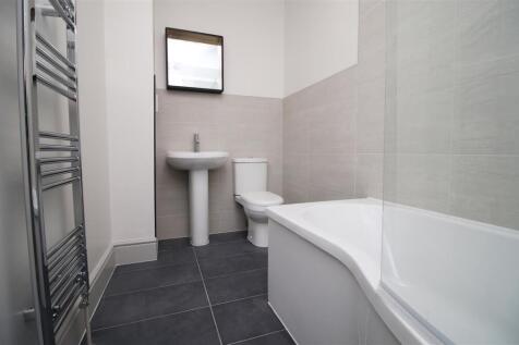 Modern bathroom suite with heated towel rail...