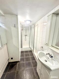 Bright bathroom with sleek walk-in shower...