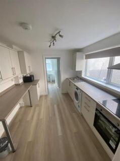 Bright modern kitchen with extensive workspace...