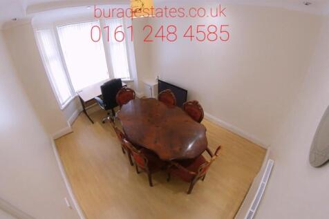 Bright dining area with table and chairs...