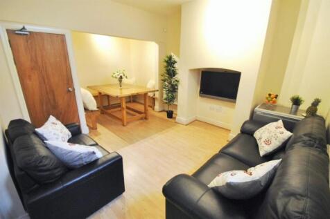 Bright, modern communal living room with two co...