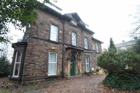 A charming traditional brick front of a semi-de...