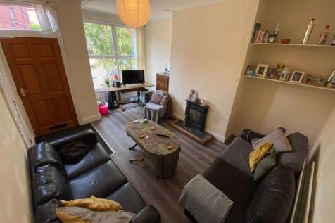 Bright and welcoming living room featuring comf...
