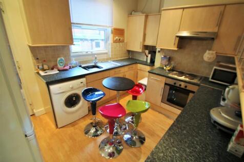 Bright kitchen with breakfast bar and seating...