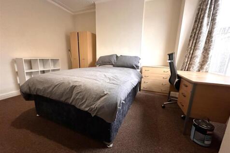 Bright, spacious bedroom with large study desk...