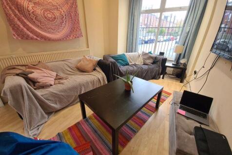 Bright and welcoming living room featuring a la...