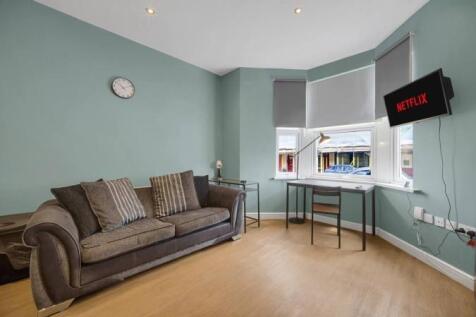 Bright lounge with bay window and study desk...