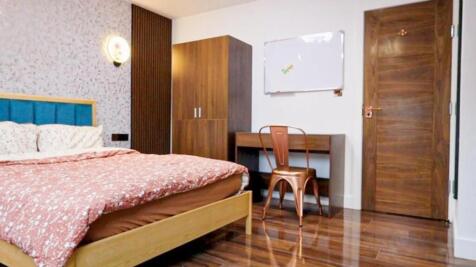 Bright, modern bedroom with a comfortable doubl...