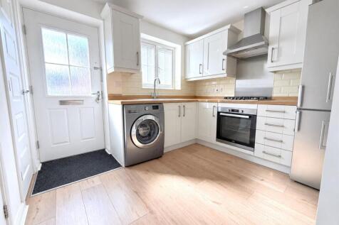 Bright Decluttered Modern Kitchen Interior.jpg