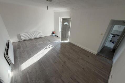 Bright and spacious lounge with wood flooring...
