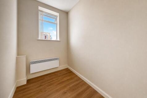 Bright storage space with wood-style flooring...