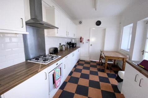 Bright kitchen with ample counter space and tab...