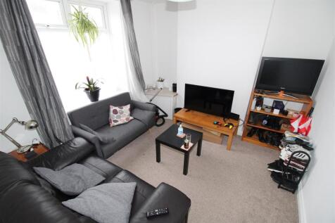Bright lounge area with comfortable sofa seatin...