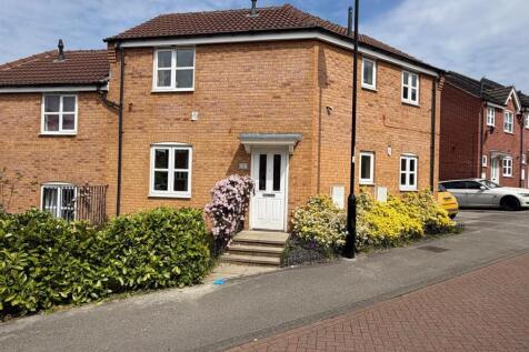 Charming brick home with lush green gardens...