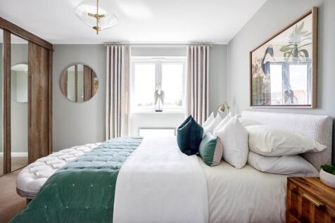 The main bedroom looks out onto the rear garden