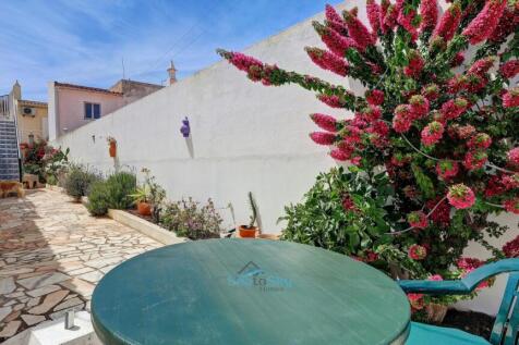 paved courtyard to front door
