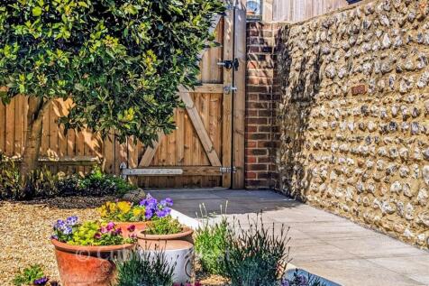 Garden Gate And Flint Wall