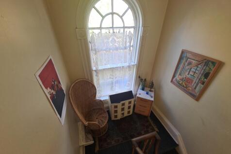 A well-lit bathroom with a window allowing natu...
