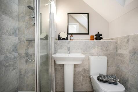 The ensuite benefits from a double shower enclosure