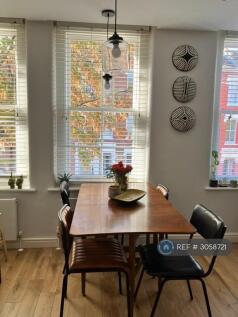 Dining Area With Three Sash Windows