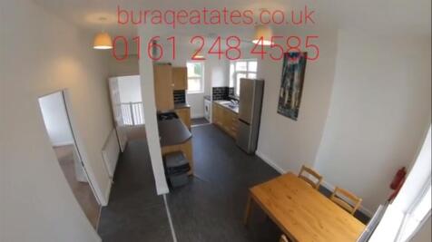 Bright, modern galley-style kitchen/dining spac...