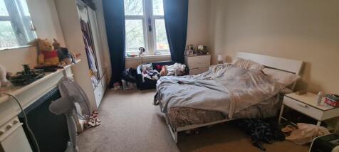 Bright, comfortable double bedroom with a large...