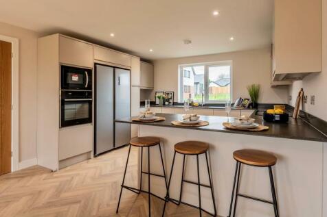 Open-plan kitchen with breakfast bar