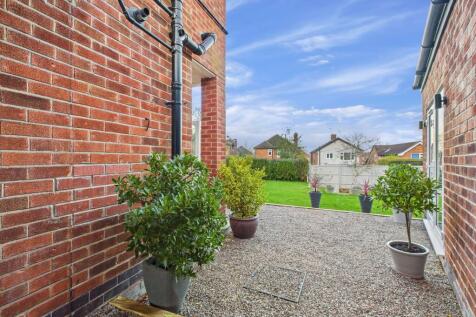 Side of House and Outbuilding leading to Rear Garden