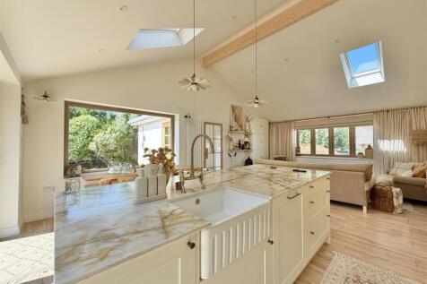 Kitchen showing vaulted ceiling