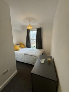 Bright and cozy double bedroom featuring a comf...