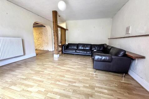 Spacious living area with sleek leather seating...