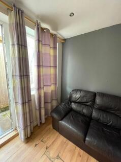 Cozy seating area with bright garden access...