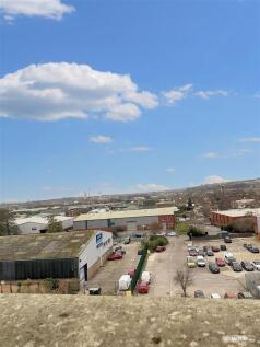 Expansive urban views under a bright blue sky...