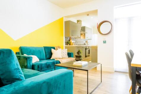 A stylish and spacious modern living room featu...