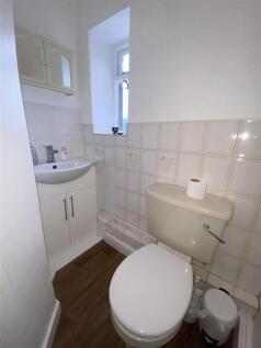 Bright bathroom with vanity unit and storage...