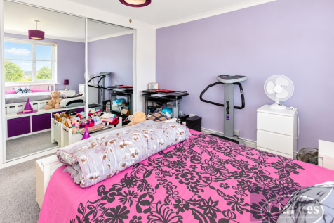 wide_angle_well_lit_clean_staged_bedroom_interi_4_