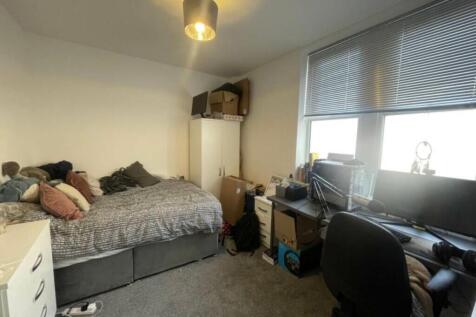 Bright, practical double bedroom with a large w...